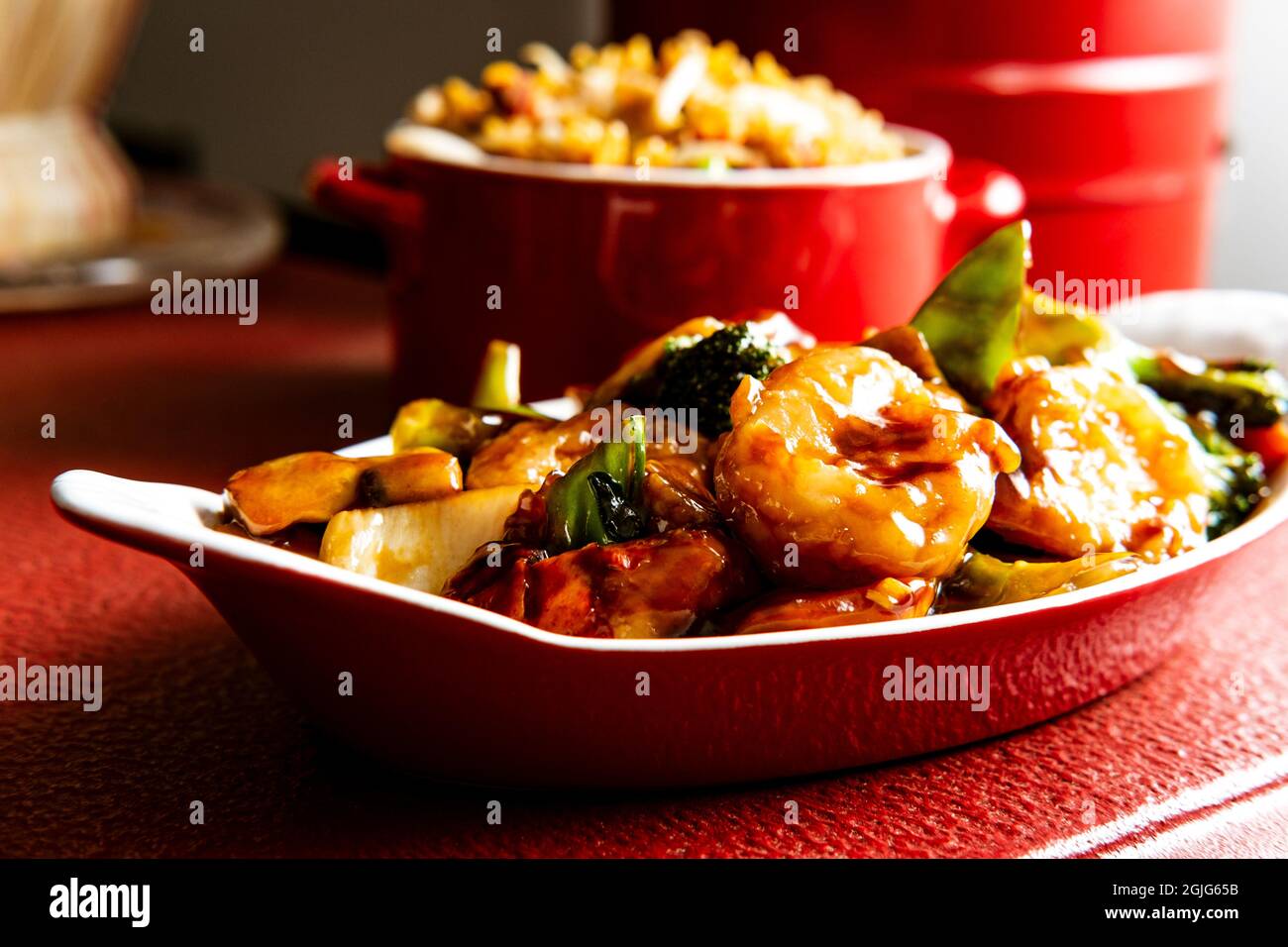 Chinese food szechuan shrimp with sauteed mixed vegetables and side of