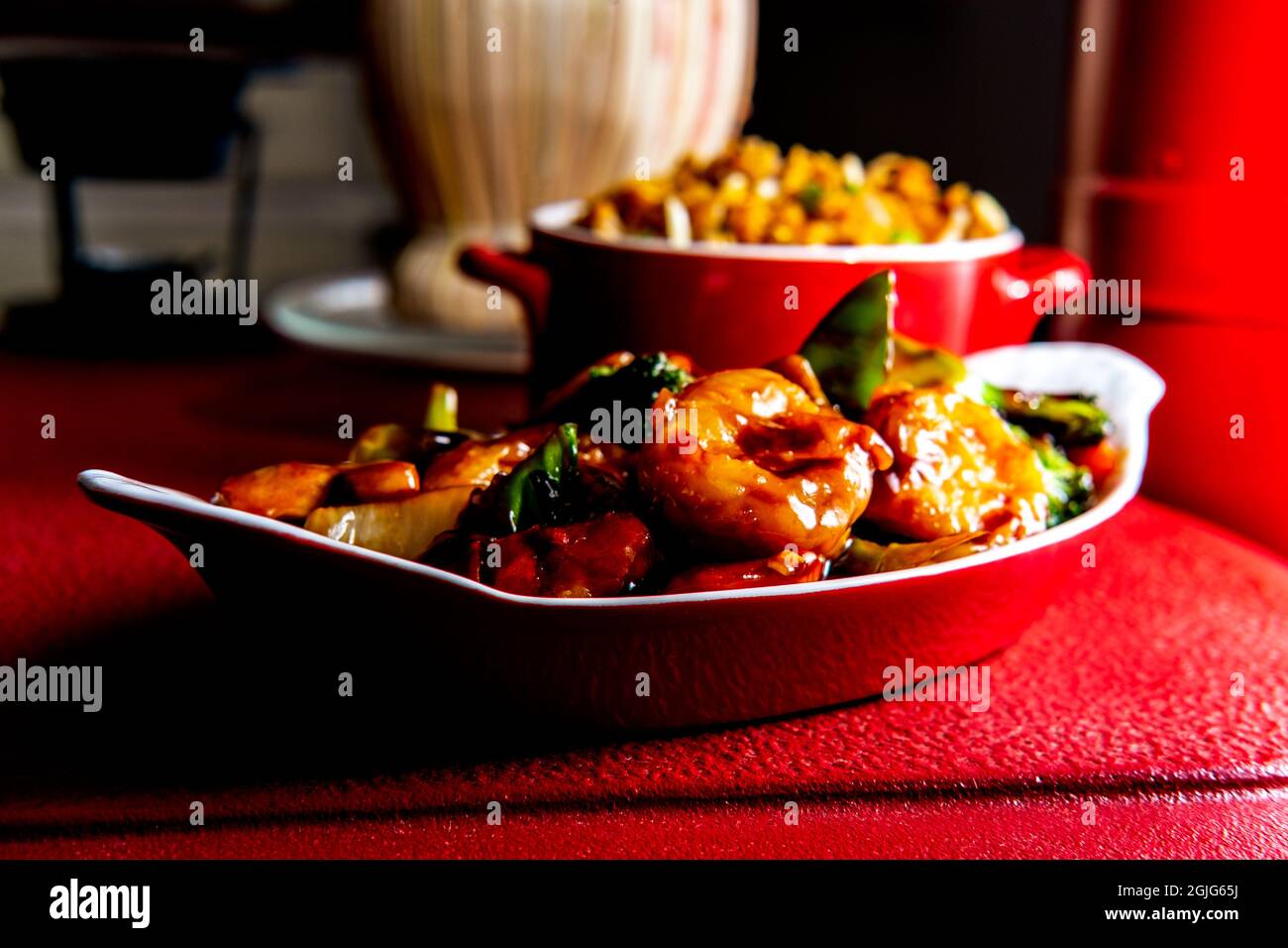 Chinese food szechuan shrimp with sauteed mixed vegetables and side of