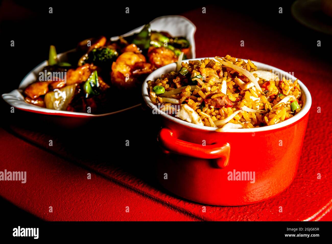 Chinese food szechuan shrimp with sauteed mixed vegetables and side of