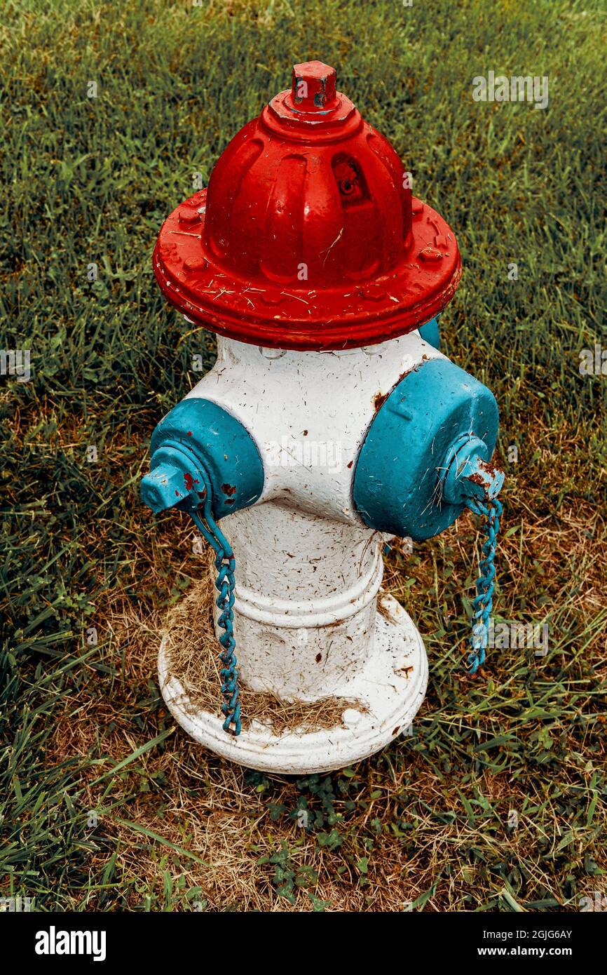 Retro stylized American fire hydrant painted red white and blue Stock Photo  - Alamy