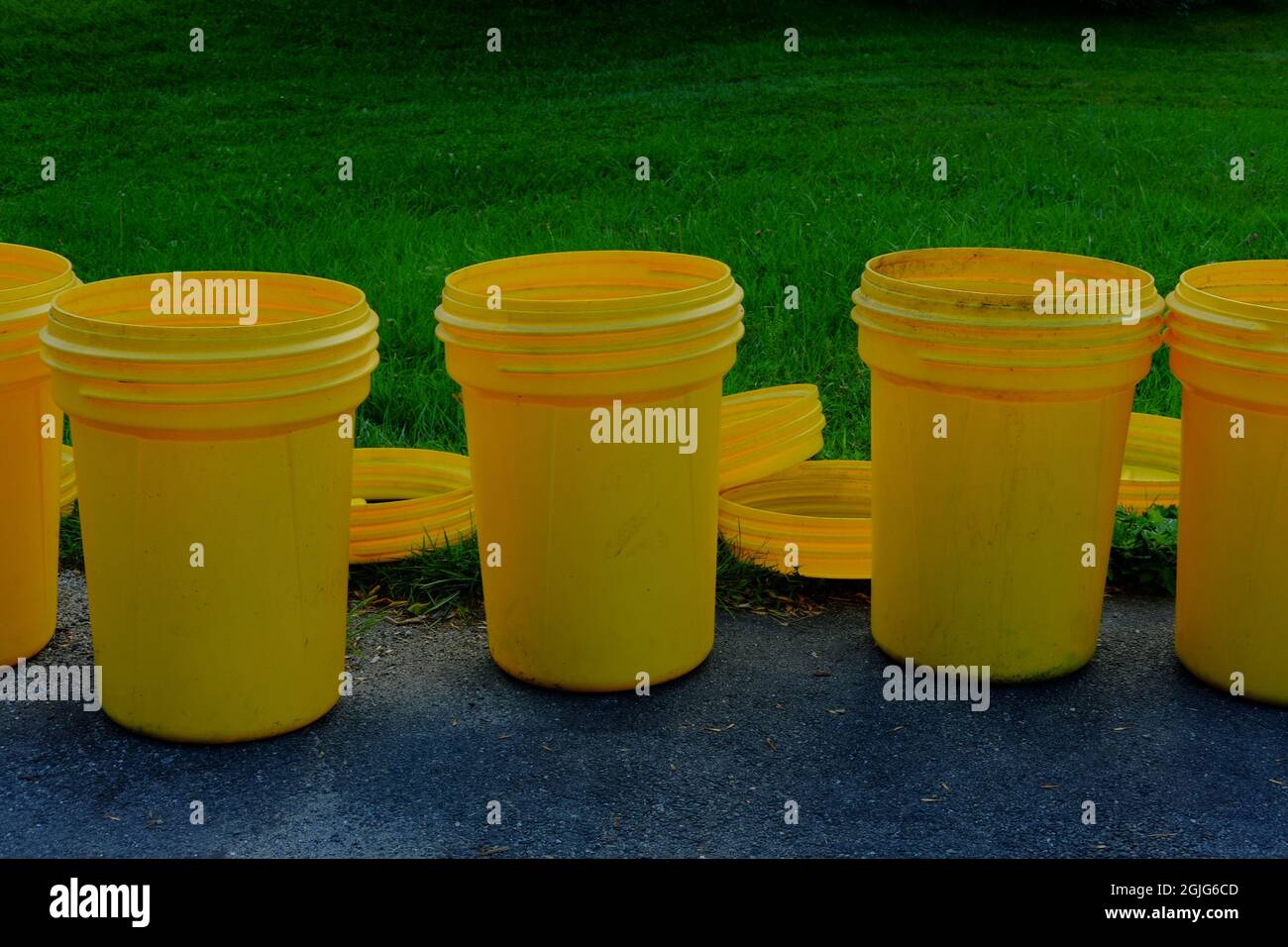 Several empty garbage cans at the end of the driveway Stock Photo Alamy