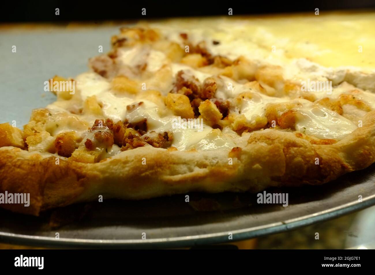 Large slices of cheese pizza New York style chicken ranch Stock Photo