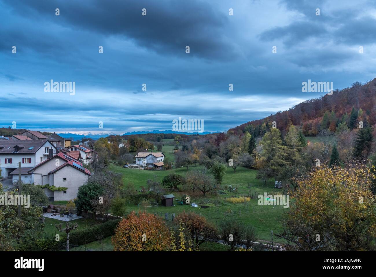 View of a typical Swiss countryside with cloudy sky. High quality photo Stock Photo