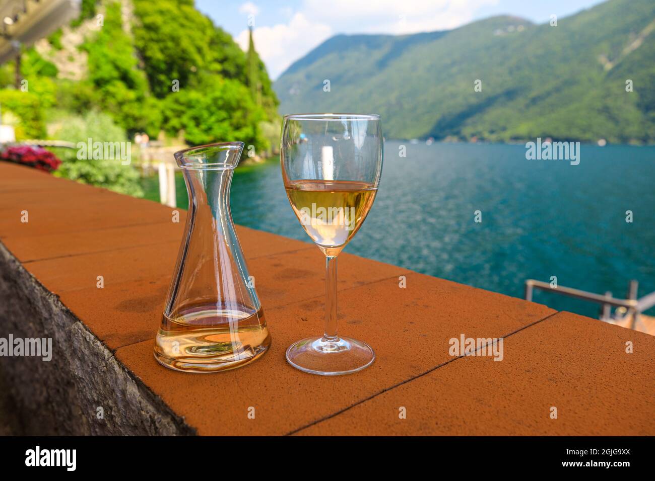 rose wine by the lakefront of Lugano city in Switzerland. Romantic  appetizer in Ticino Canton on Swiss Lake Lugano. Olive trees pathway of  Lugano in Stock Photo - Alamy