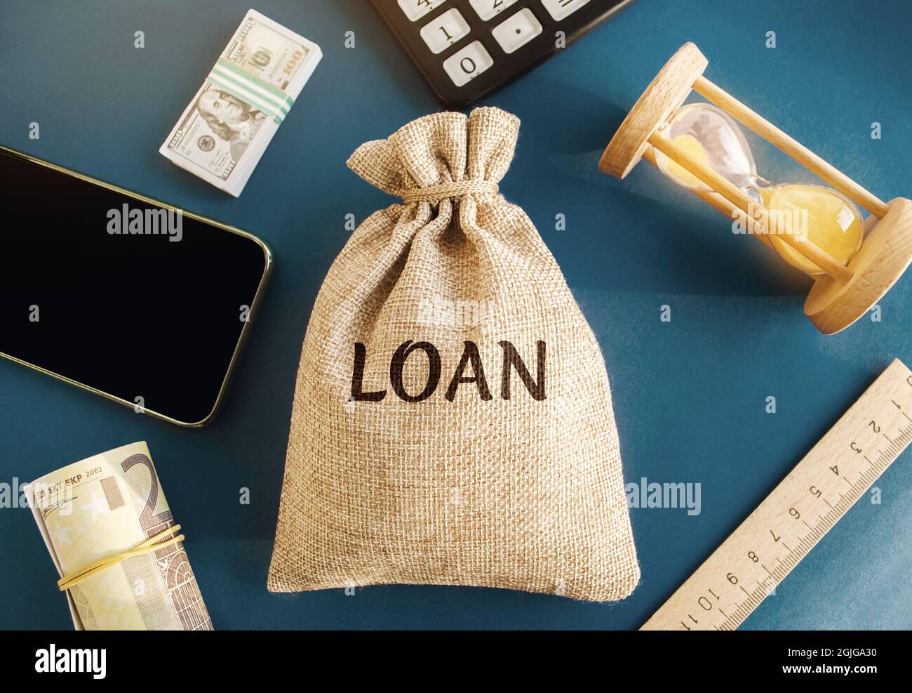 Money bag with the word Loan. The concept of accumulation of money for the payment of credit debt. Mortgage lending. Savings. Family budget. Real Esta Stock Photo
