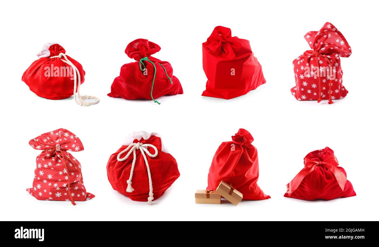 Set of Santa Claus bags full of gifts on white background Stock Photo ...