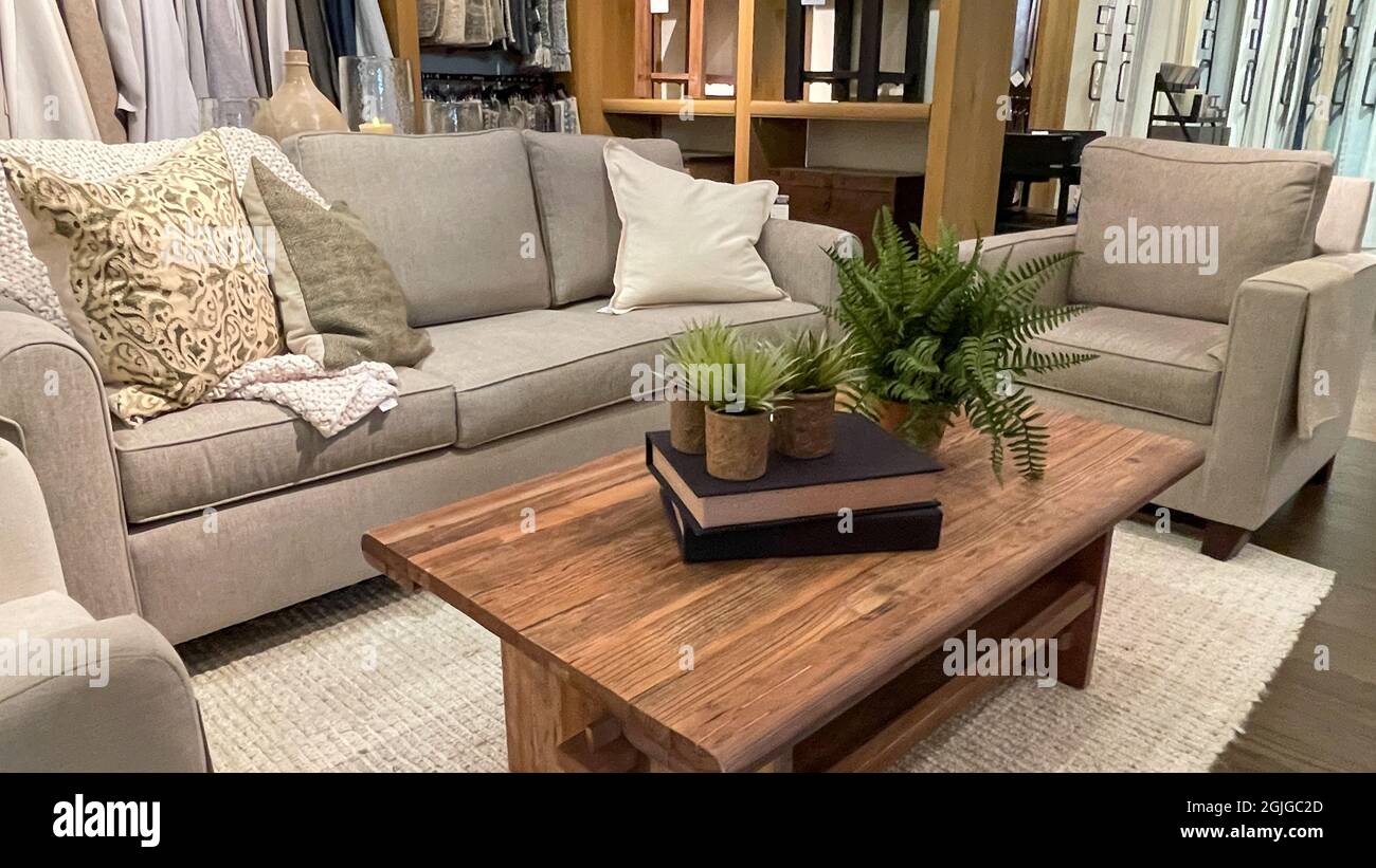 Orlando ,FL USA - September 4, 2021: A display of couches and tables at ...