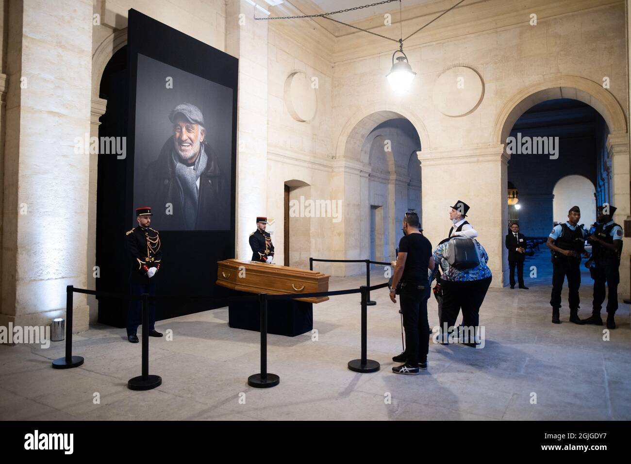 People dress as the Guignolo Belmondo character pay their respects to late  French actor Jean-Paul Belmondo as they stand in front of his coffin at the  end of the national tribute ceremony