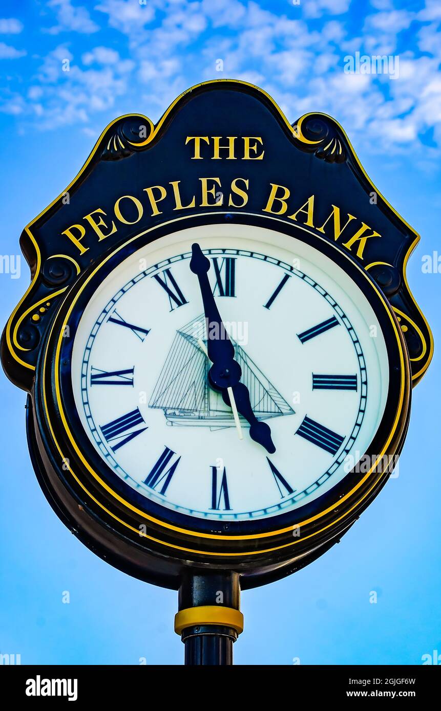 The Peoples Bank street clock features a ship on the clockface, Sept. 5, 2021, in Biloxi, Mississippi. Stock Photo