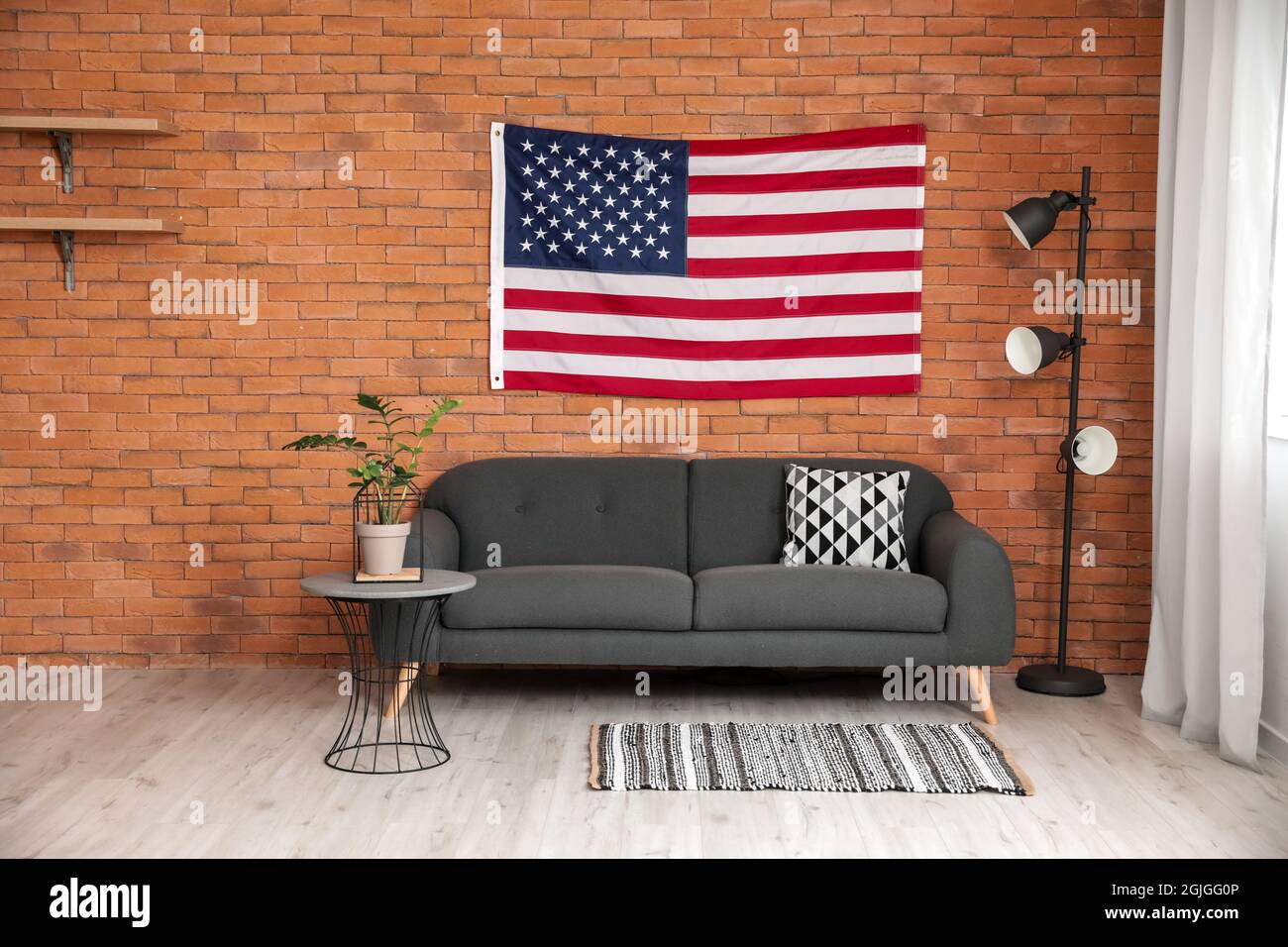 Interior of stylish living room with USA flag Stock Photo - Alamy