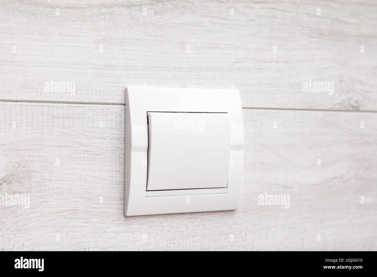 Modern light switch on white wall Stock Photo Alamy