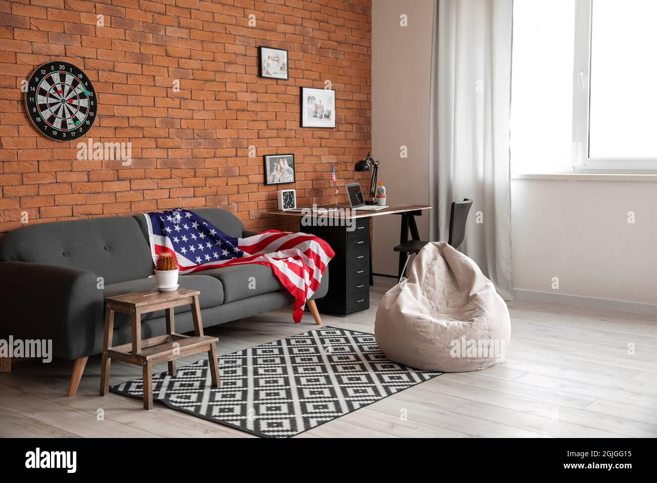 Interior of stylish living room with USA flag Stock Photo - Alamy