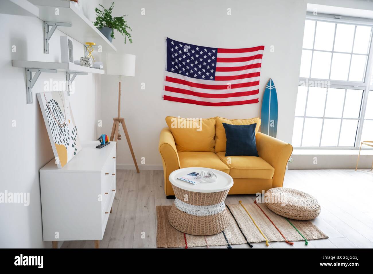 Interior of stylish living room with USA flag Stock Photo