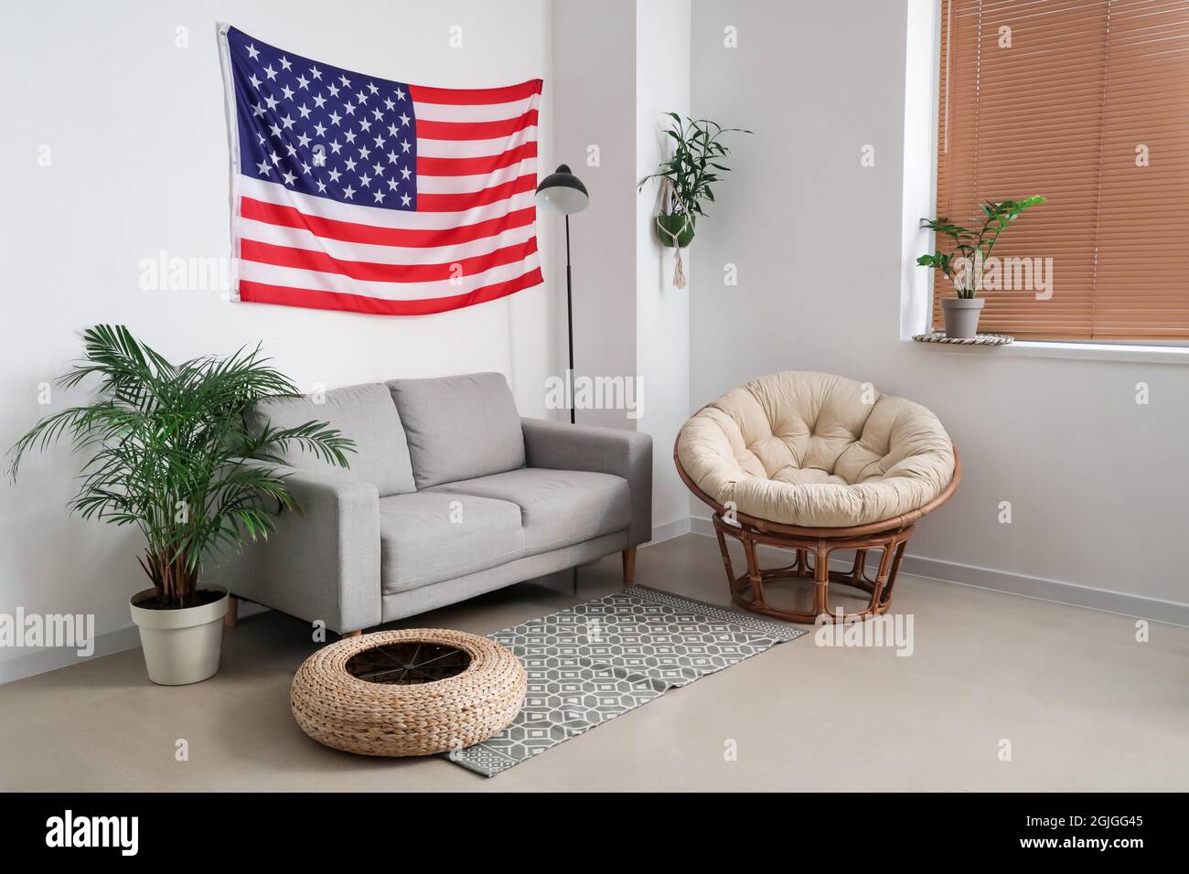 Interior of stylish living room with USA flag Stock Photo - Alamy