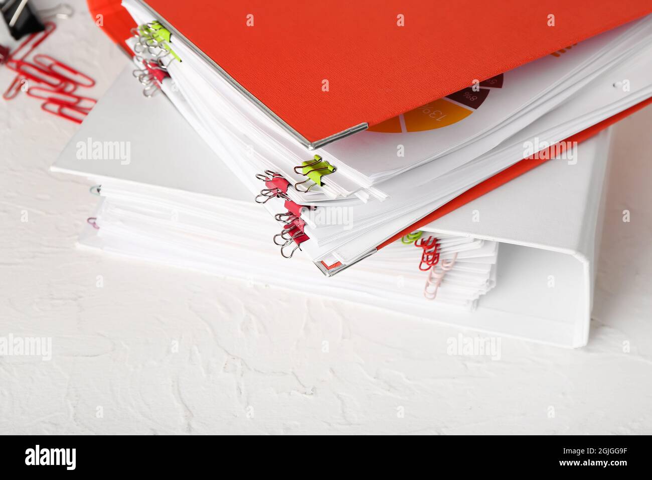 Stack of folders with documents on table Stock Photo