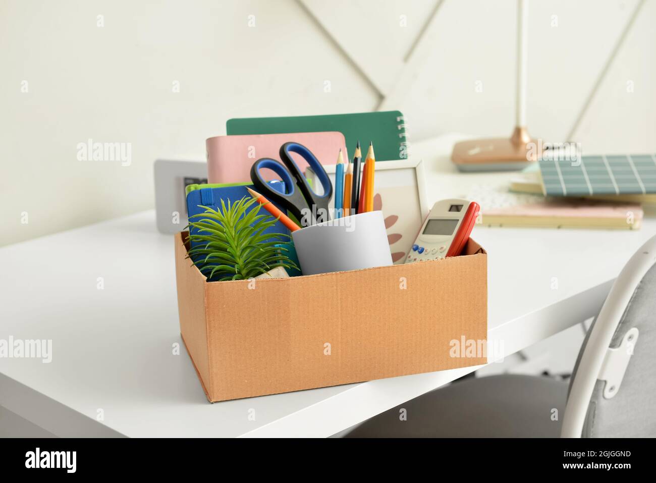 Box with personal stuff on table in office Stock Photo Alamy