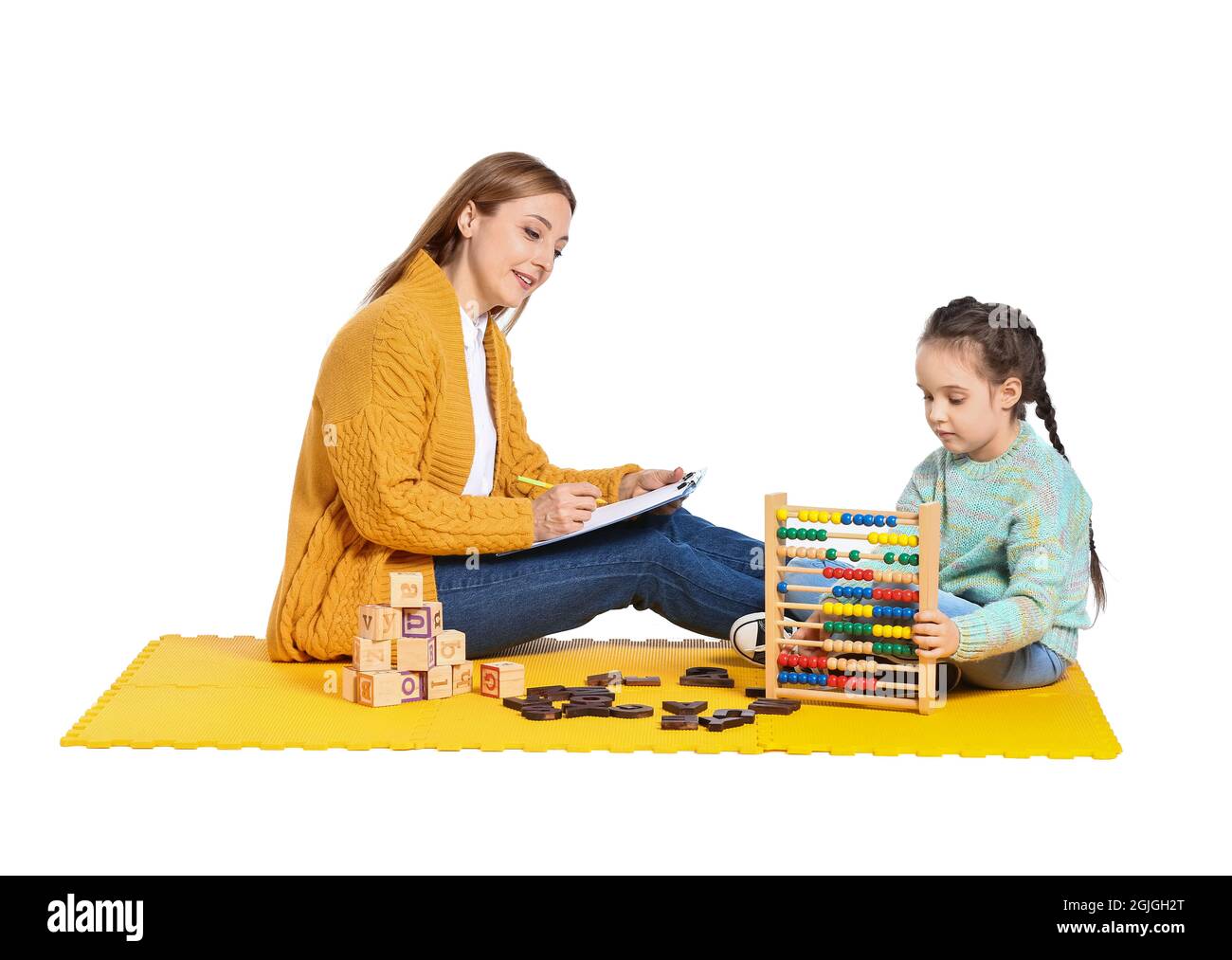 Female psychologist working with girl suffering from autistic disorder on white background Stock