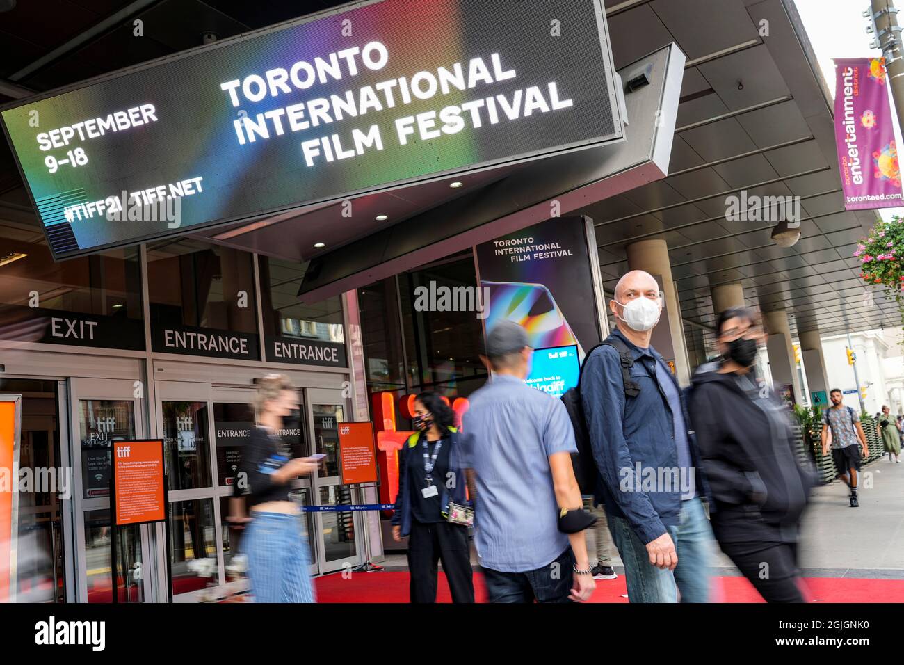 People are seen outside the TIFF Bell Lightbox building, headquarters of the Toronto International Film Festival (TIFF), in Toronto, Canada, September 9, 2021. REUTERS/Mark Blinch Stock Photo