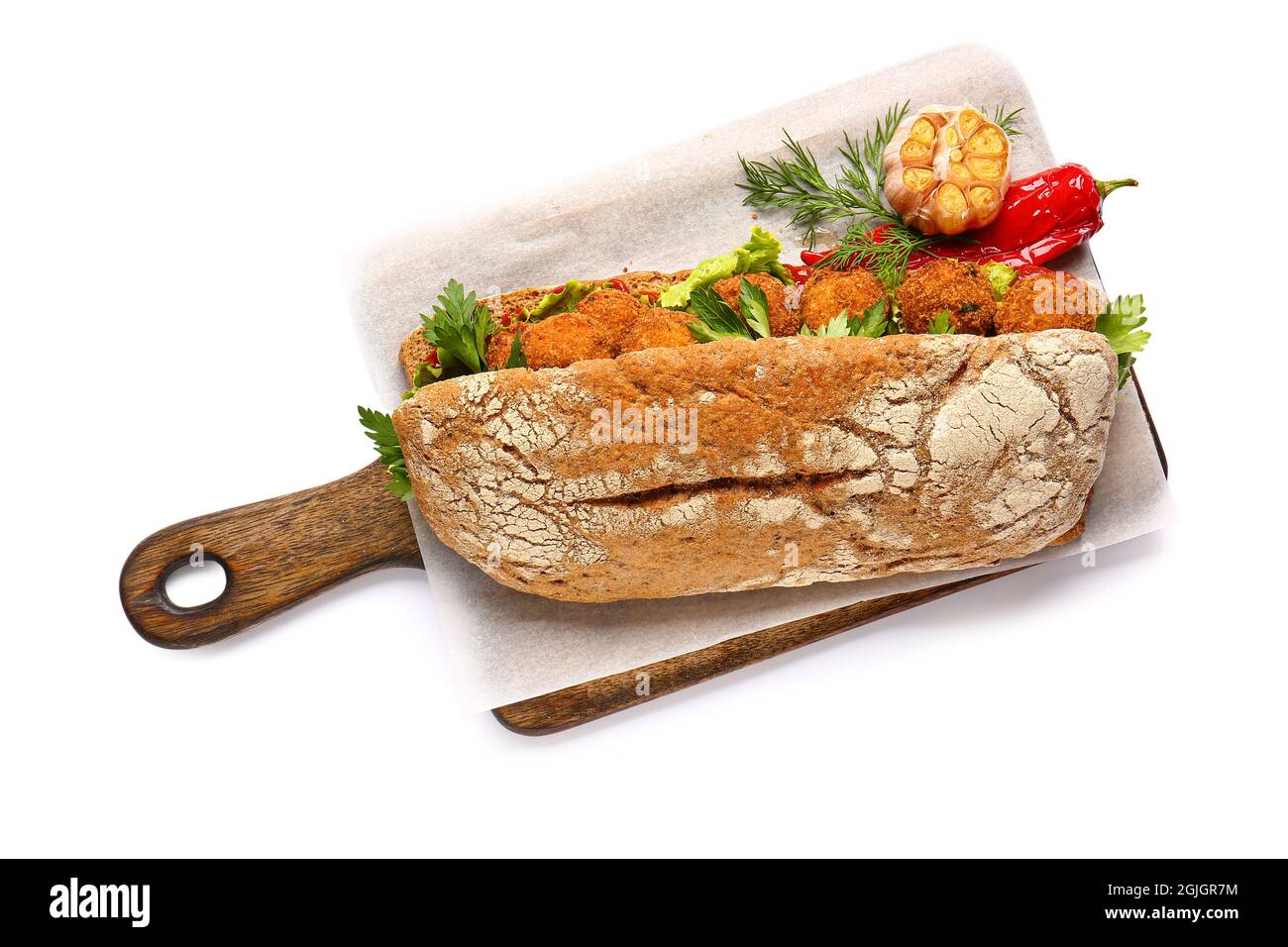 Board with bread and tasty cod cutlets on white background Stock Photo