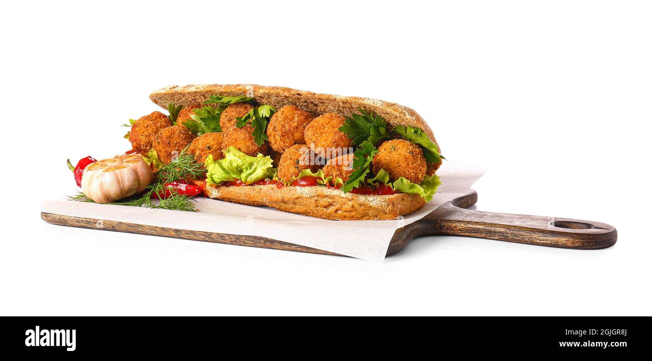 Board with bread and tasty cod cutlets on white background Stock Photo