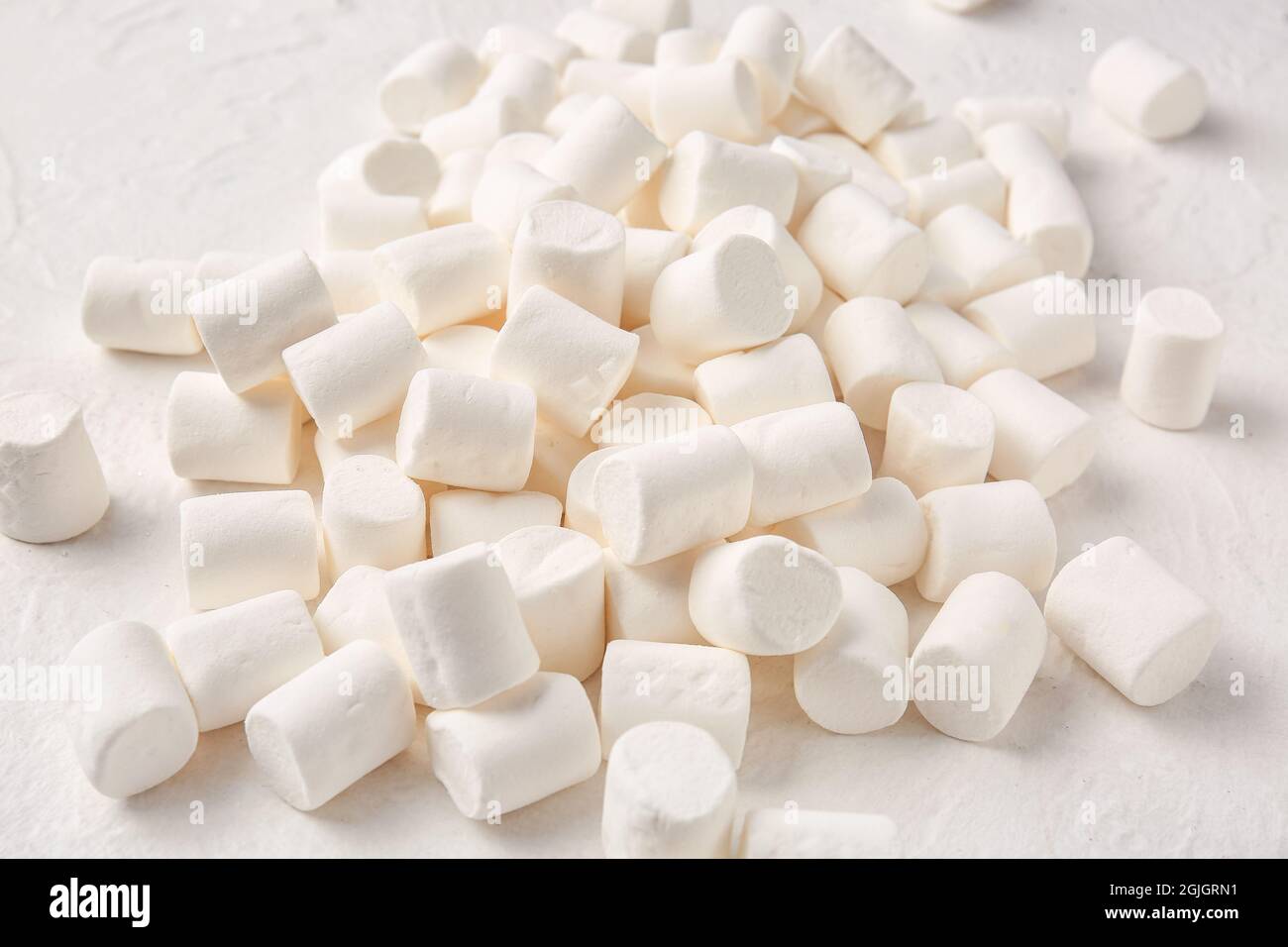 Heap of tasty marshmallows on light background Stock Photo - Alamy