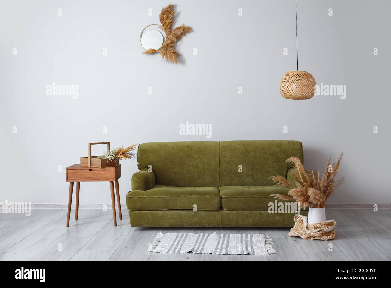 Interior of modern room with sofa and table Stock Photo - Alamy