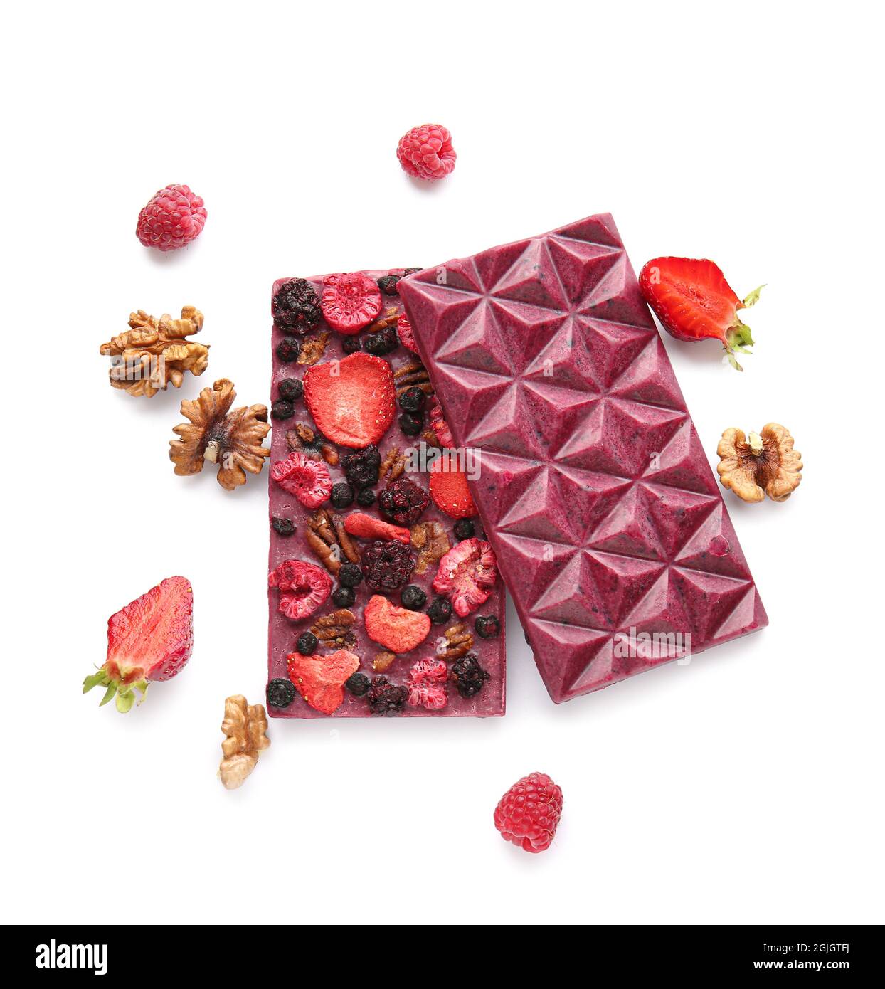 Handmade chocolate bars with fruits, berries and nuts on white ...