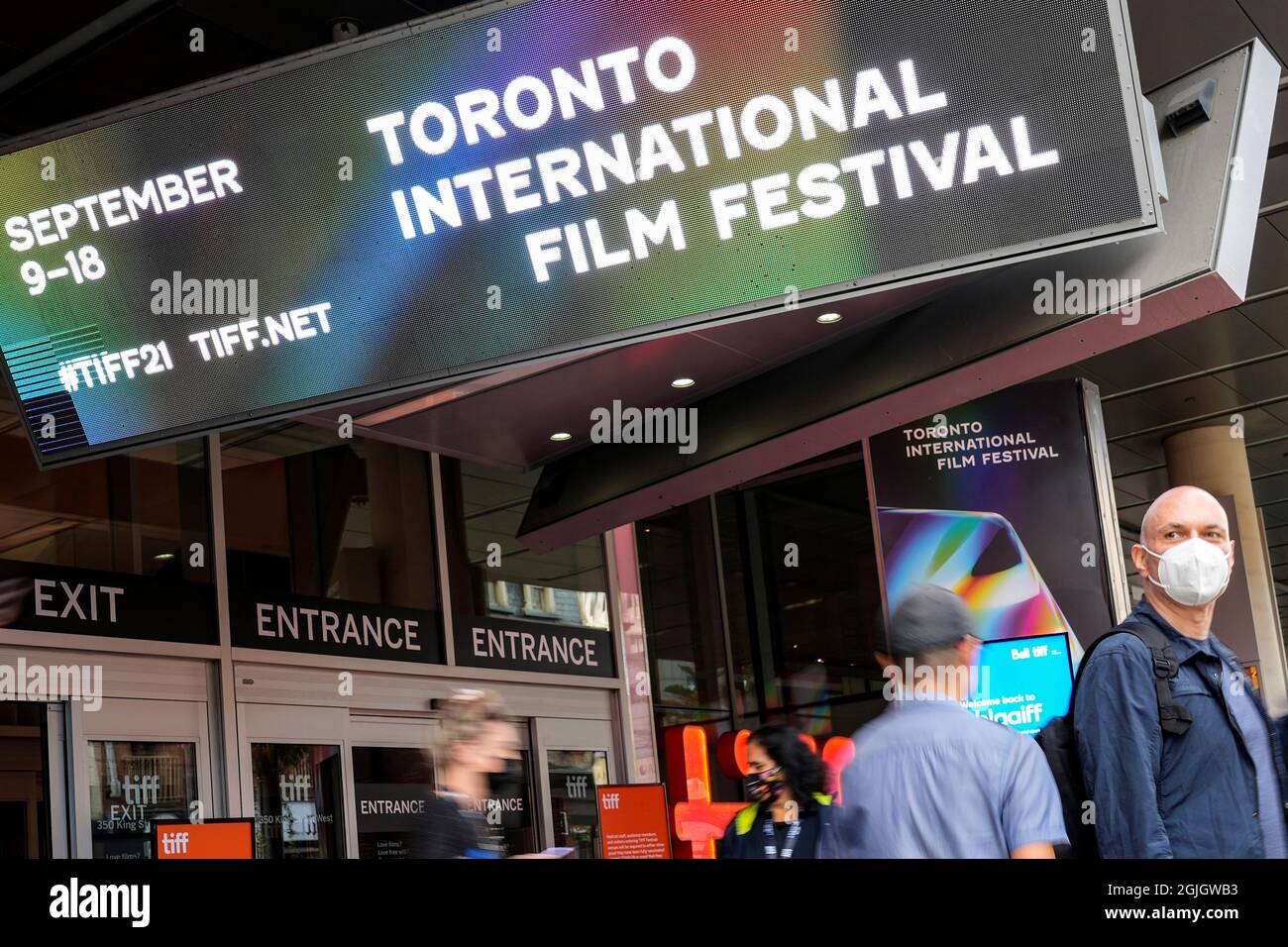 People are seen outside the TIFF Bell Lightbox building, headquarters of the Toronto International Film Festival (TIFF), in Toronto, Canada, September 9, 2021. REUTERS/Mark Blinch Stock Photo