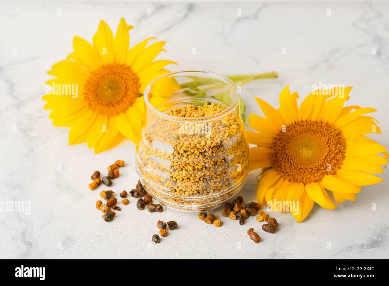 Jar of bee pollen and beebread on white background Stock Photo