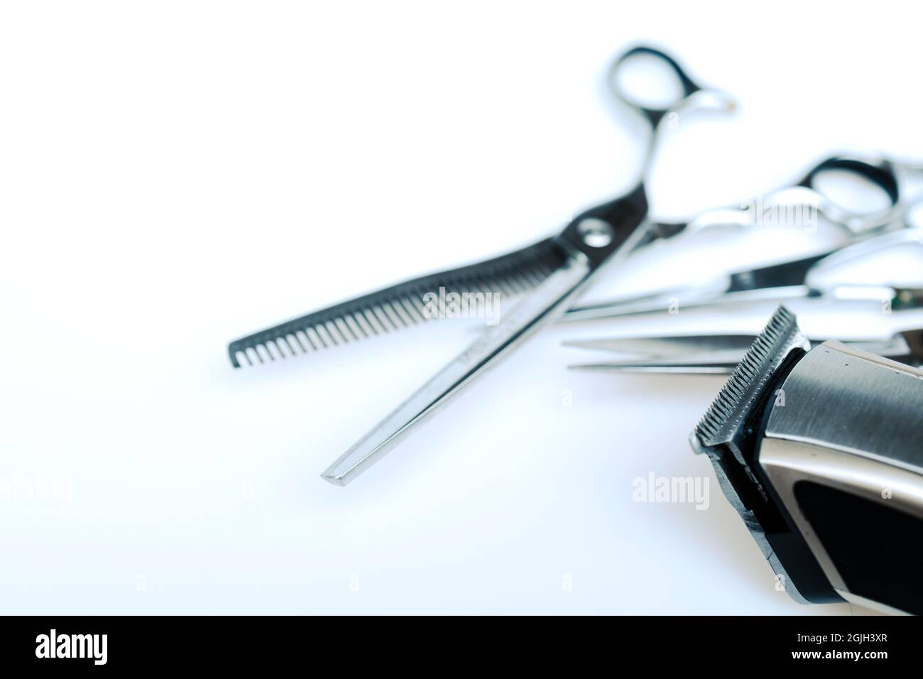 Professional barber's hair cutting tools set on white background Stock