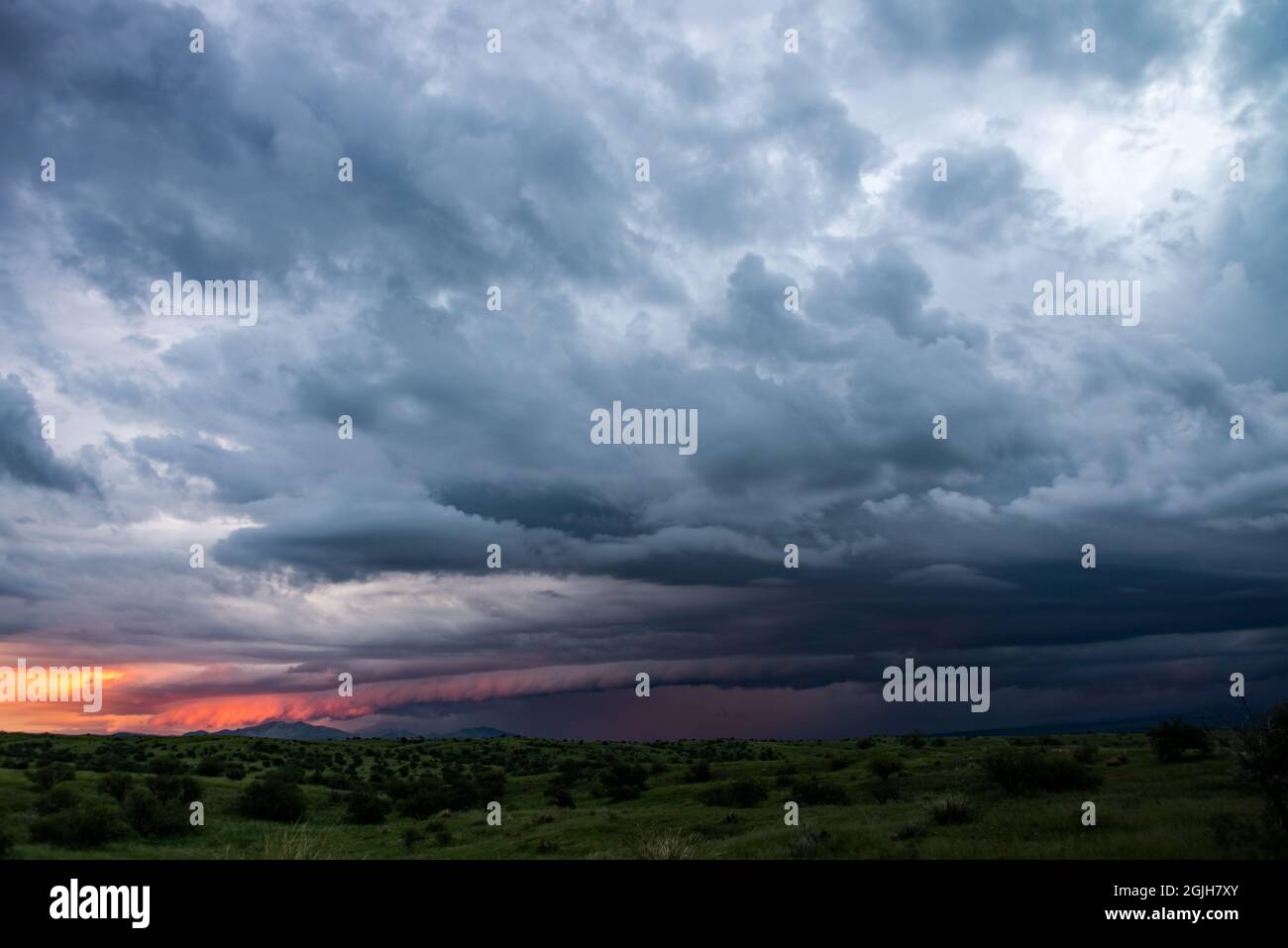 Shelf cloud at sunset over grasslands Stock Photo