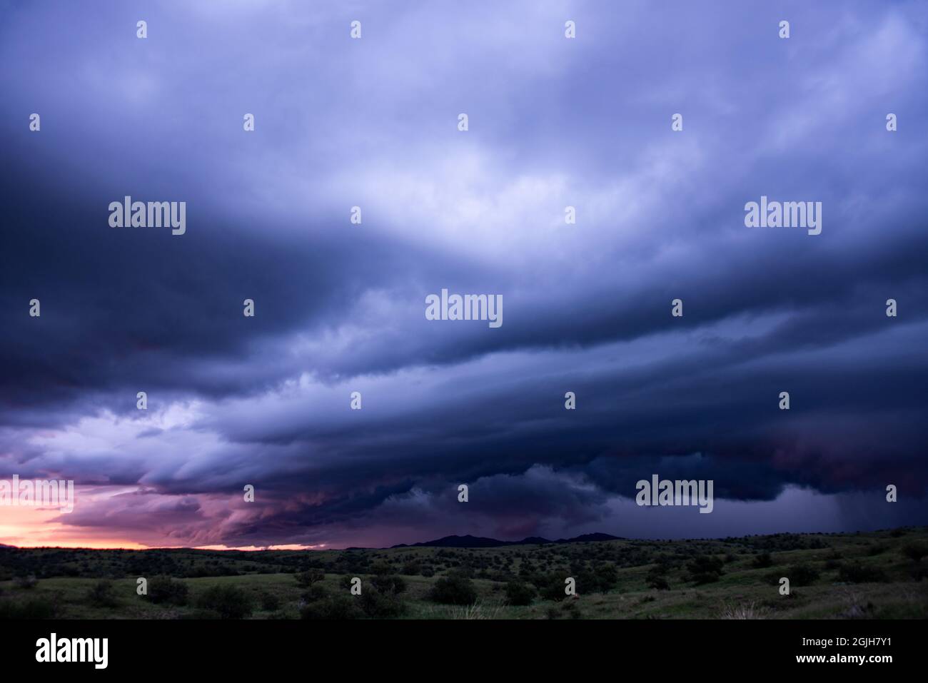 Shelf cloud at sunset over grasslands Stock Photo