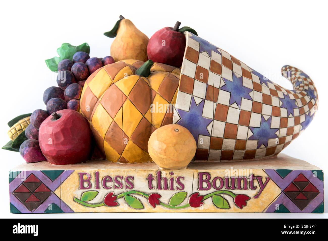Decorative and colorful wooden horn of plenty with fruit and Thanksgiving concept blessing Stock