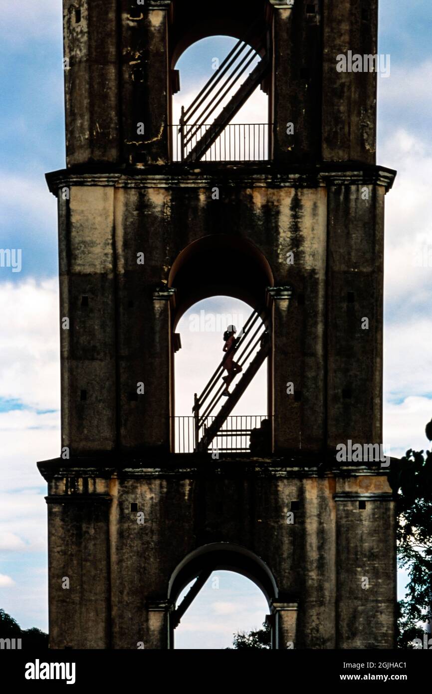 Silhouette of runner running up the stairs at Tower Mirador de La Loma del Puerto, Valle de los Ingenios, Trinidad, Cuba Stock Photo