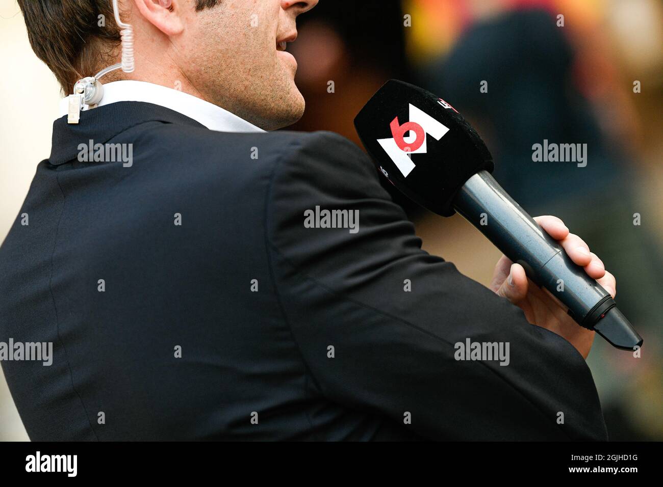 Paris, France on September 9, 2021: Paris, France. 09th Sep, 2021.  Microphone held by a journalist (illustration) (mic, mike, micro) of the  French TV channel "M6" during Jean-Paul Belmondo's national tribute held