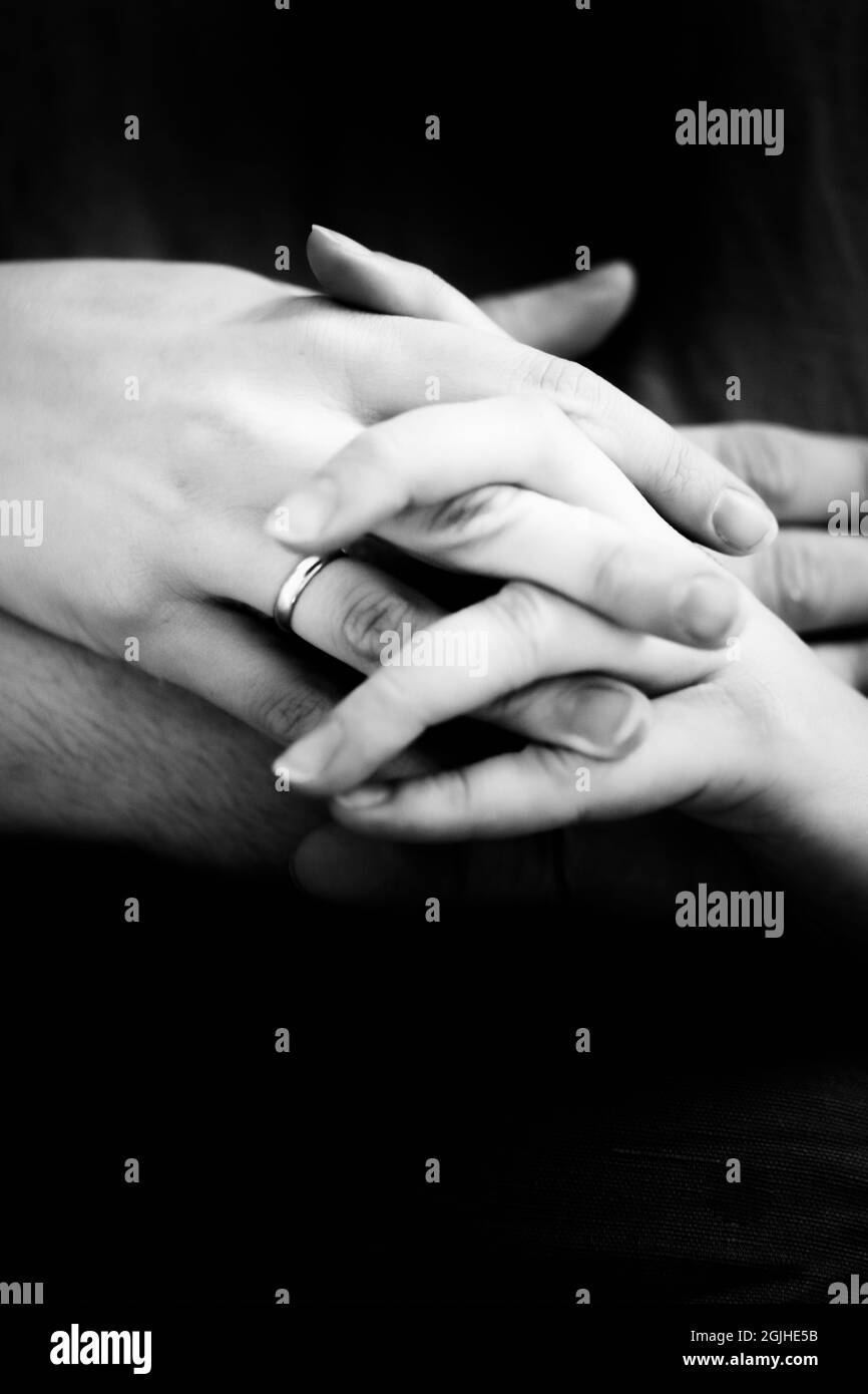 the hands of loving people are intertwined Stock Photo