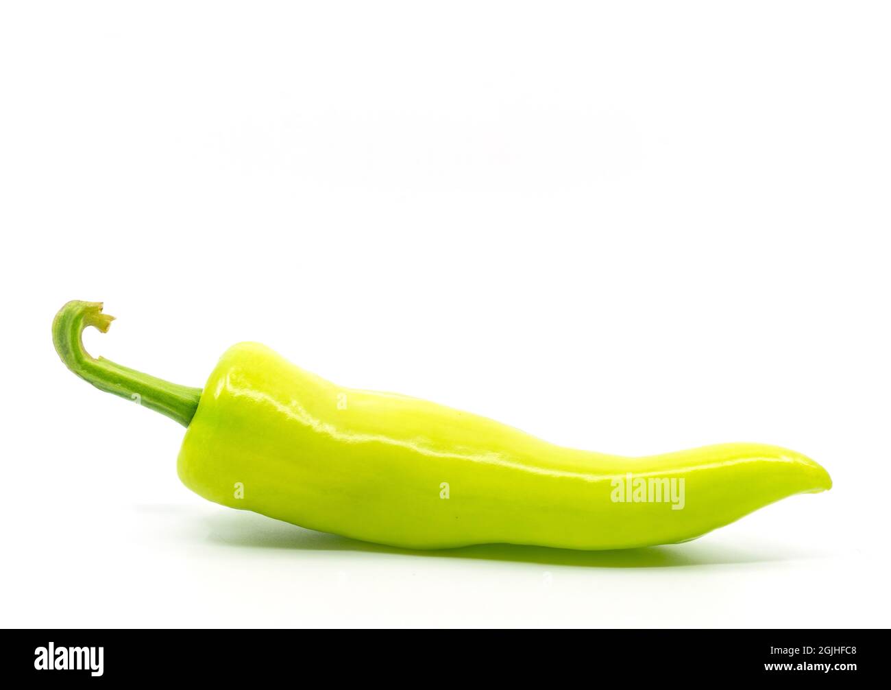 Side view of one green pepper or banana peppers on white background. Stock Photo