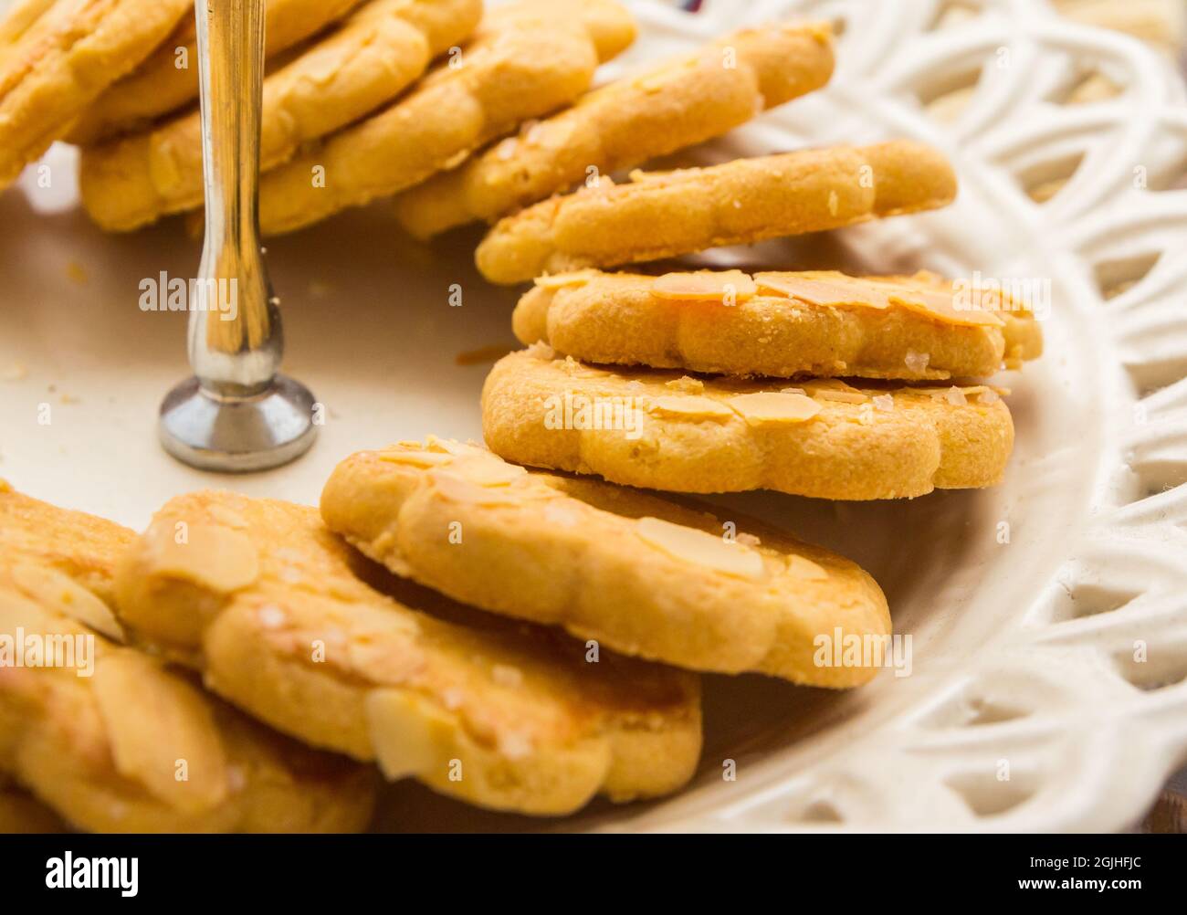 Typical dutch kerstkrans cookie for celebration of Christmas on a white dish Stock Photo