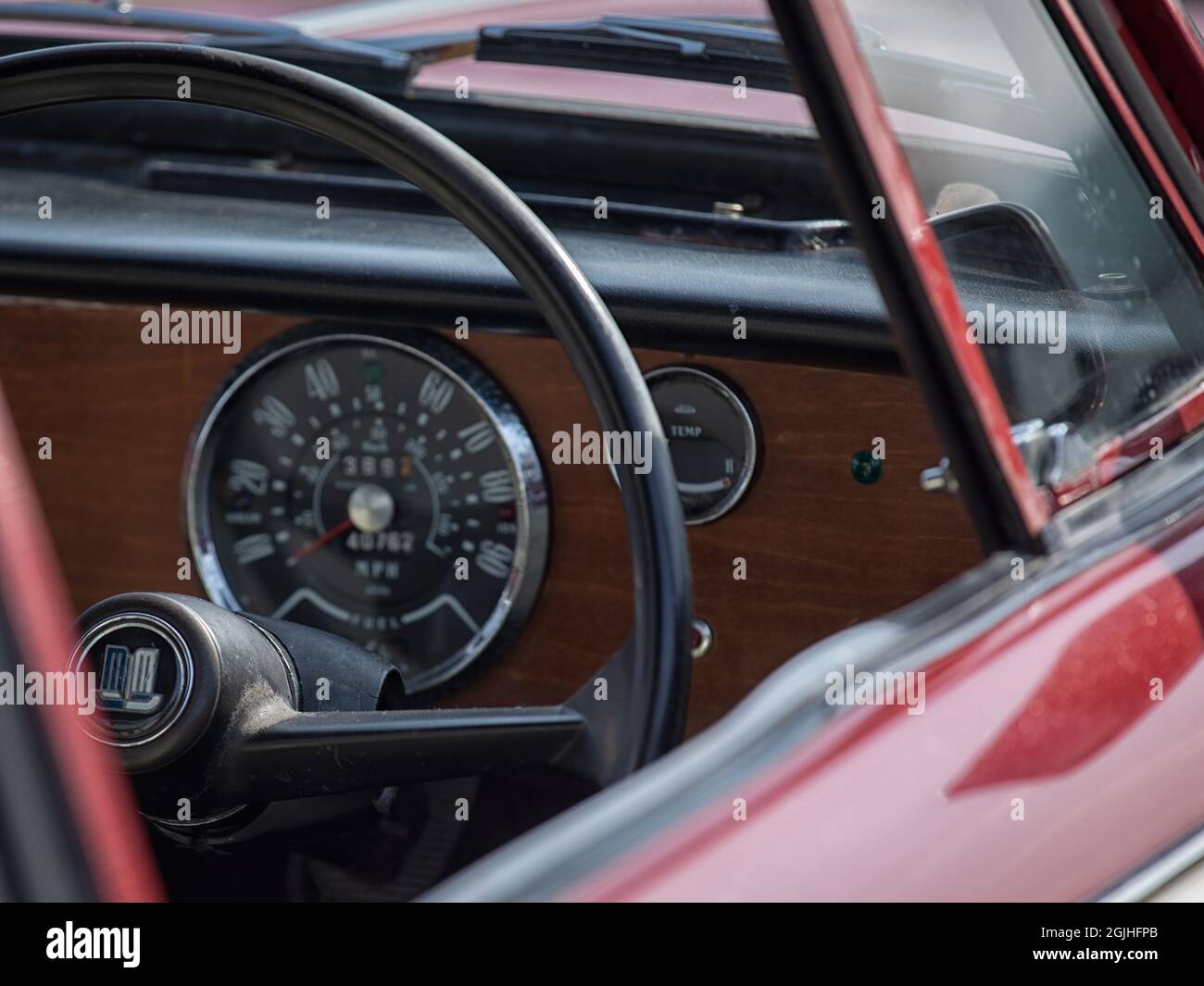 ESSEX, UK - SEPTEMBER 05, 2021:  Steering wheel and defocused dashboard of classic Triumph Herald 1200 Stock Photo