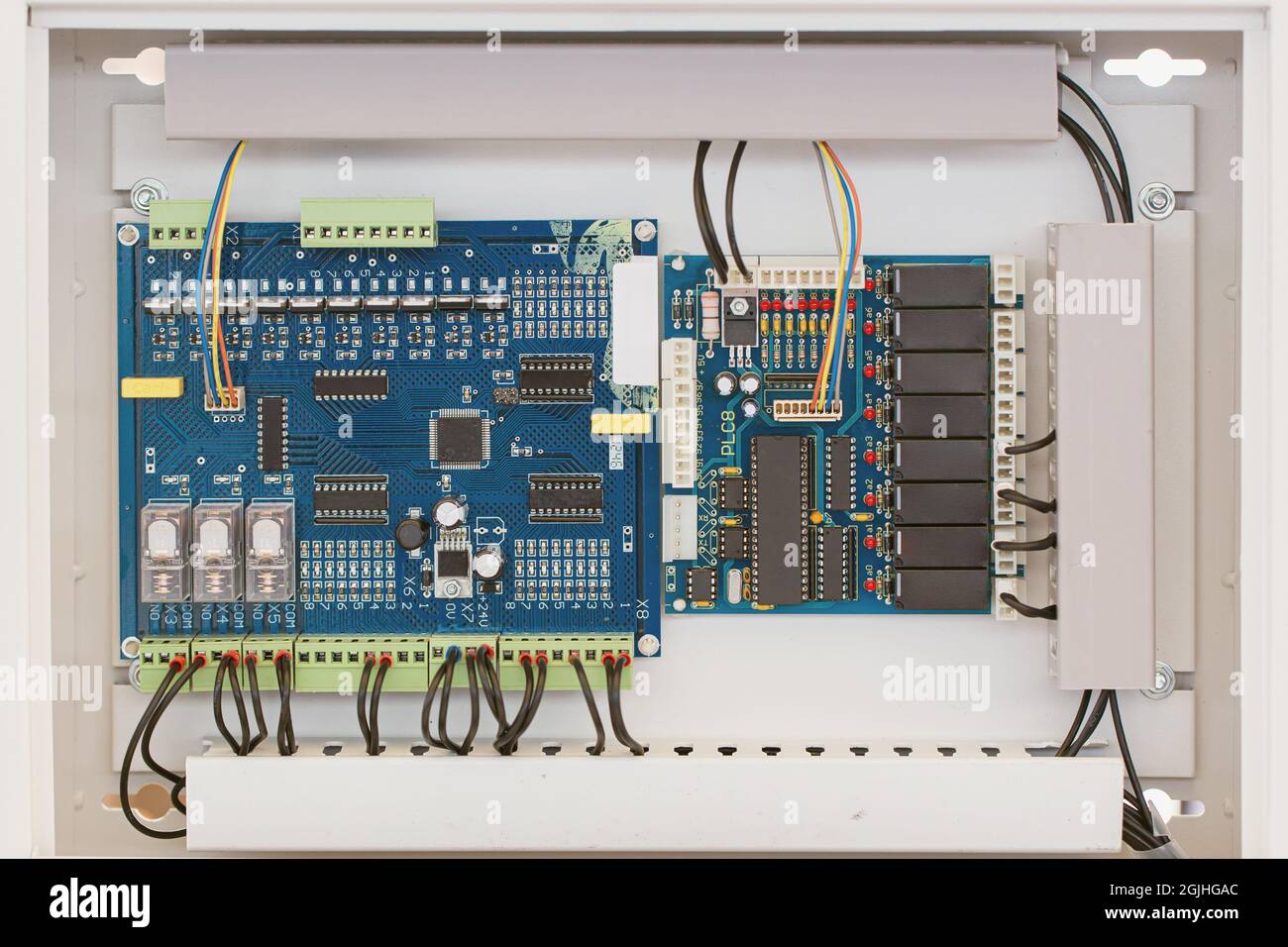 Digital electronic circuit board inside weather proof box, imbedded system for automatic working in agriculture field. Stock Photo