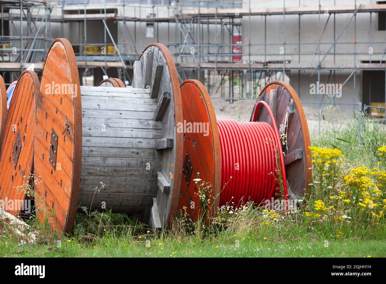 Huge spools  with  cables for the construction industry to connect new built houses Stock Photo