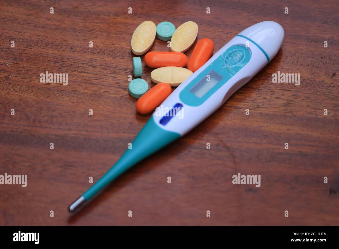 During the COVID-19 pandemic, always prepare medical equipment and  medicines. Photo of thermometer and pills for pain medicine Stock Photo -  Alamy
