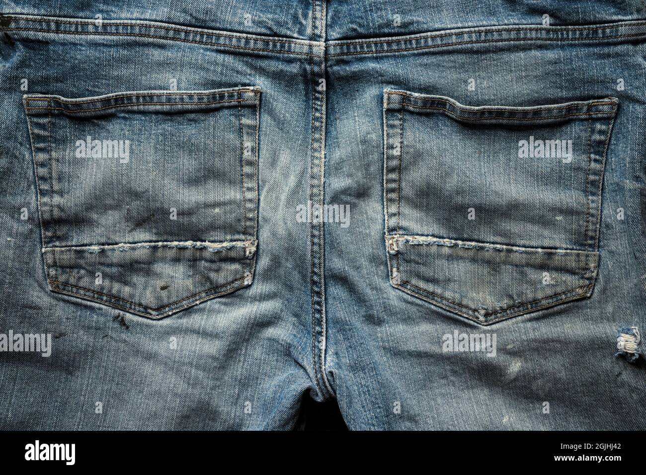 Back side of old denim jeans. Stock Photo