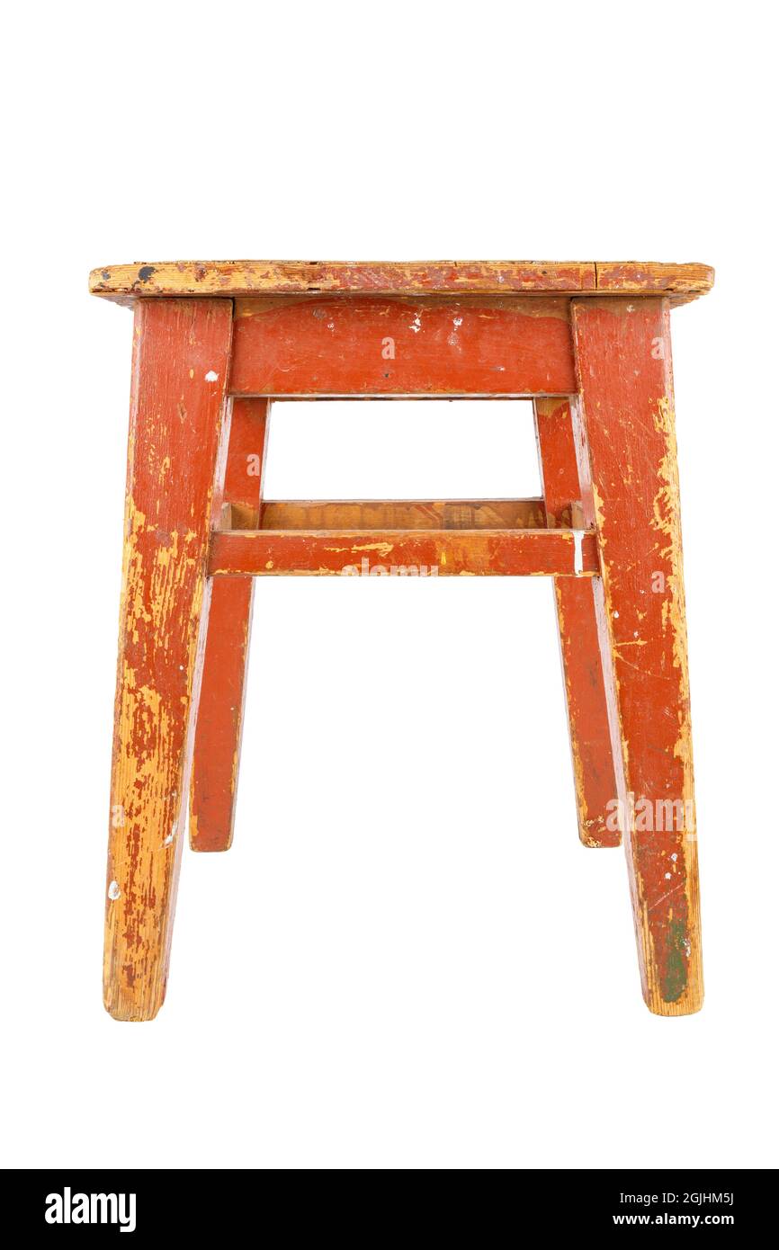 old used wooden stool with brown peeling paint. Loft style chair