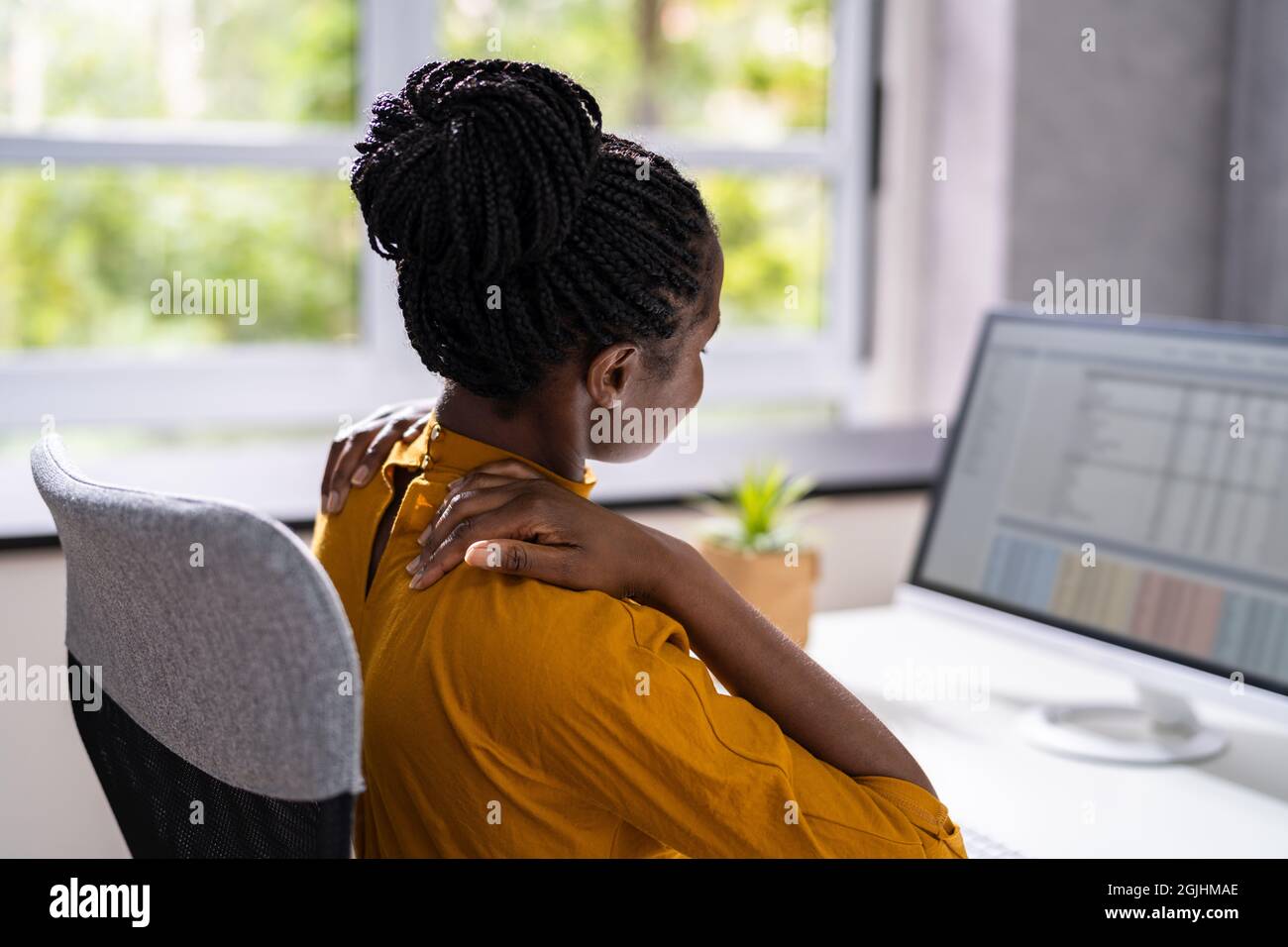 Ergonomic Chair And Posture Behind Workstation Computer. Shoulder Pain
