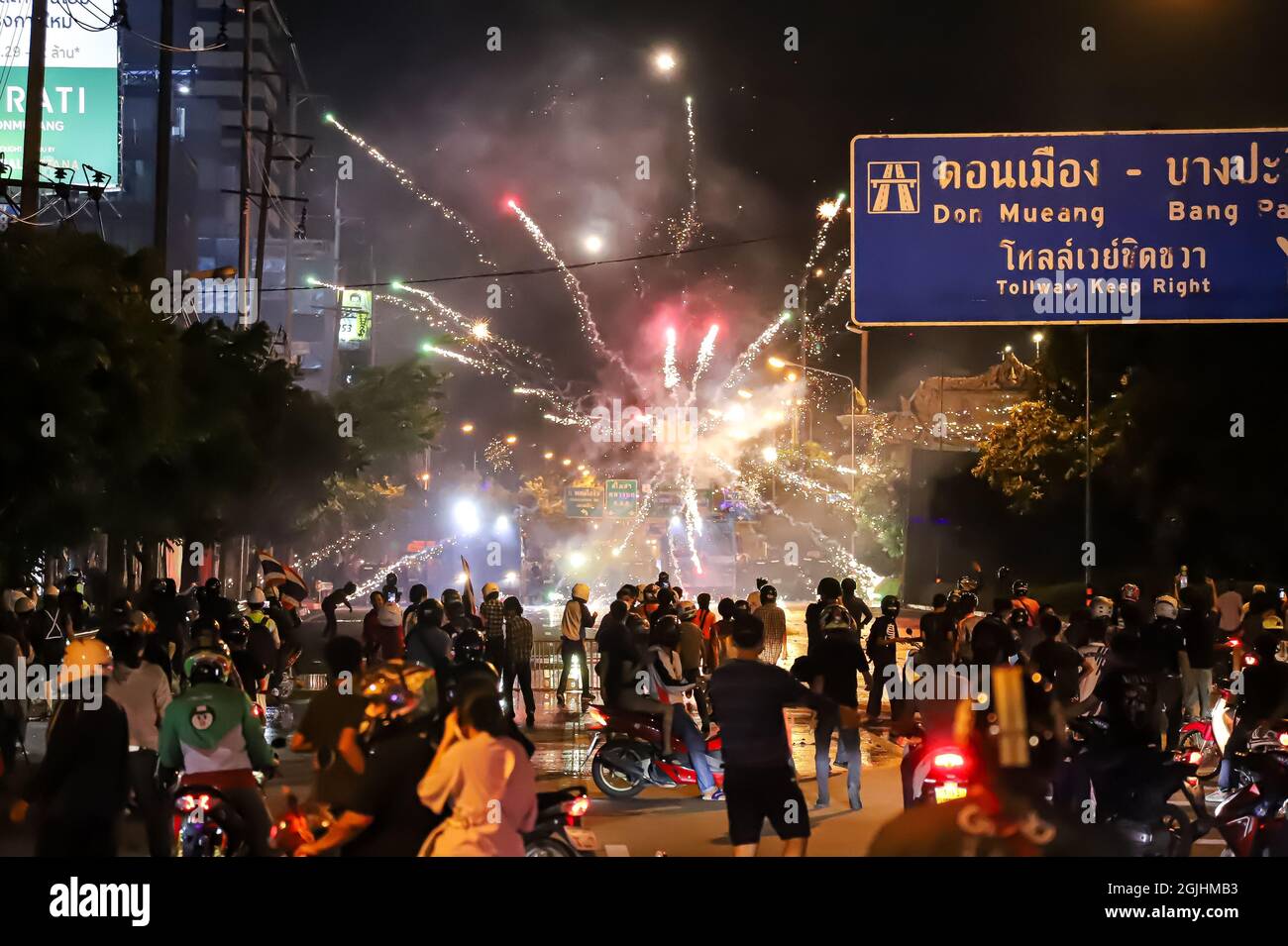 Bangkok, THAILAND - August 22, 2021: Anti-government protesters shoot the  fireworks to Riot police line during clashed at Vibhavadi Rangsit Road  Stock Photo - Alamy