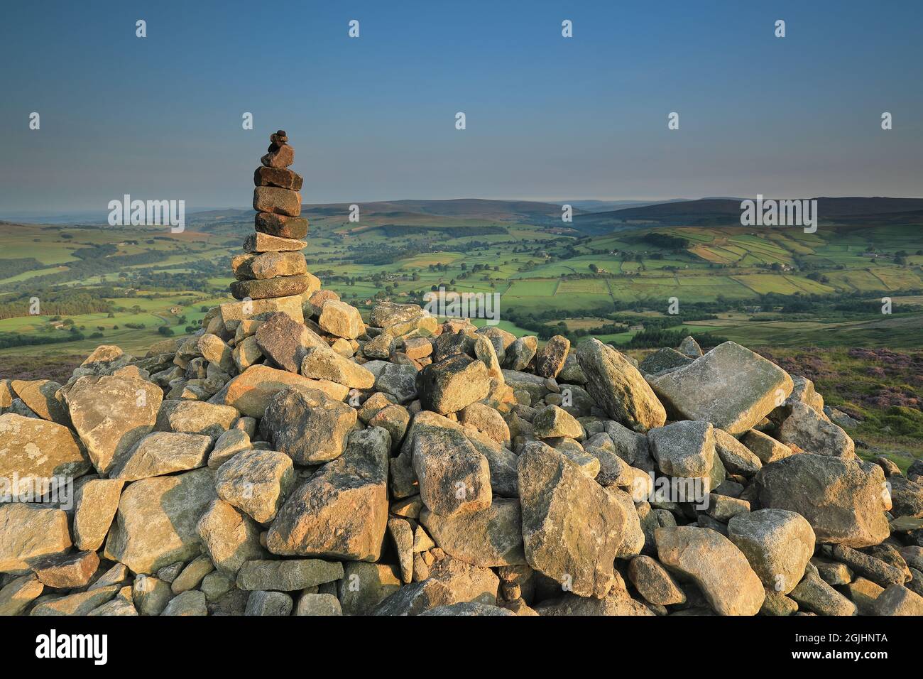 Rocks stacked on top of a cairn, on the summit of Beamsley Beacon, a hill in Wharfedale, Yorkshire Dales National Park, UK Stock Photo