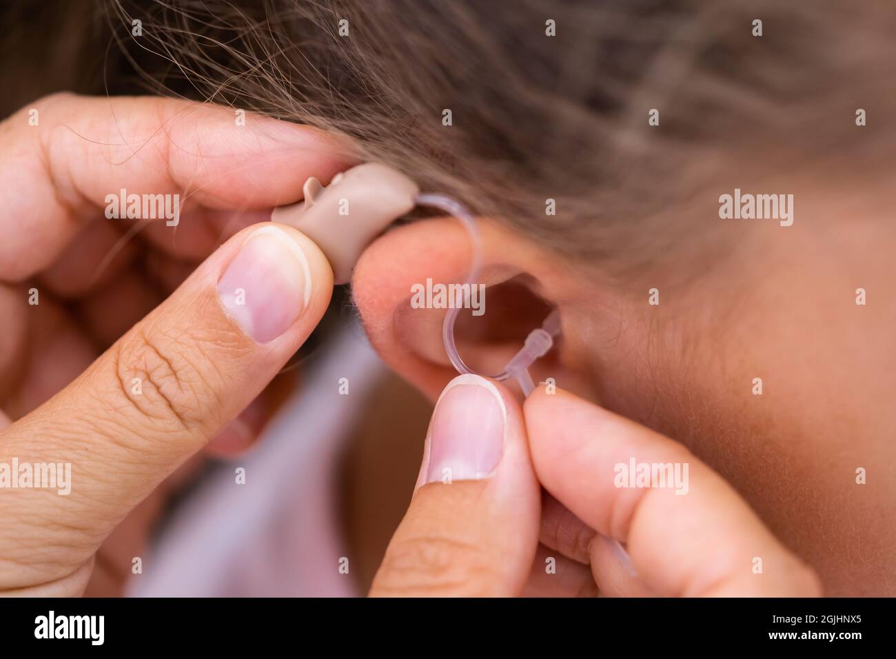 Audiology Hearing Aid For Child. Audiologist And Deaf Disability Stock Photo