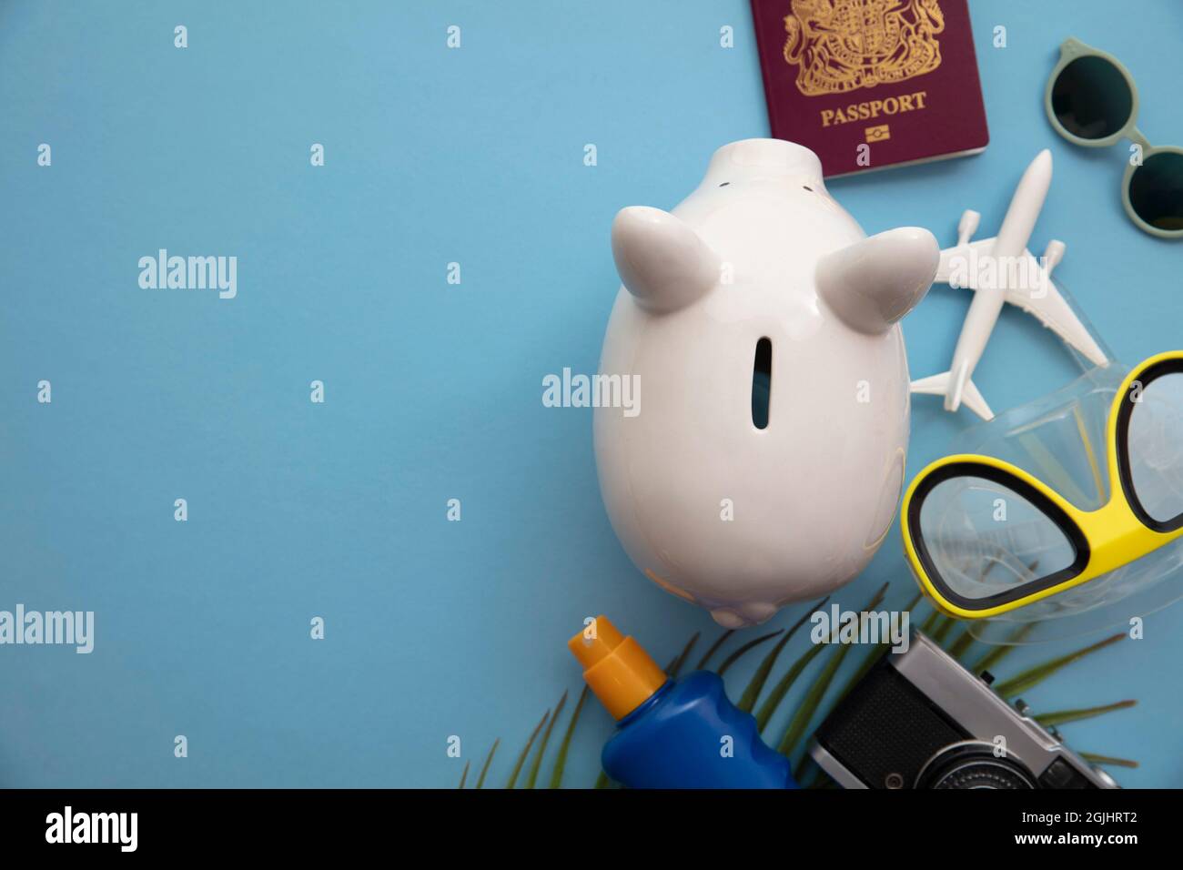 Summer holiday piggy bank background. Saving up for a vacation Stock Photo