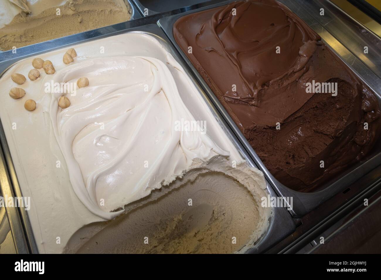 Italian artisan ice cream (Gelato) manufacturing. Serving process in